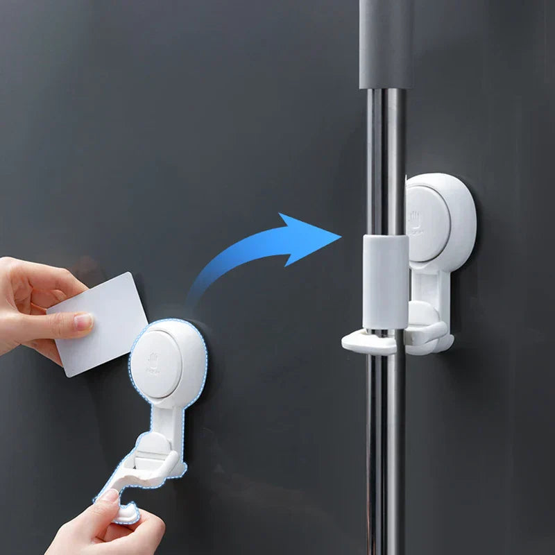 Suction Cup Hook - Demonstration of hook removal using a flat card, with arrow showing repositioning to hold a tool handle