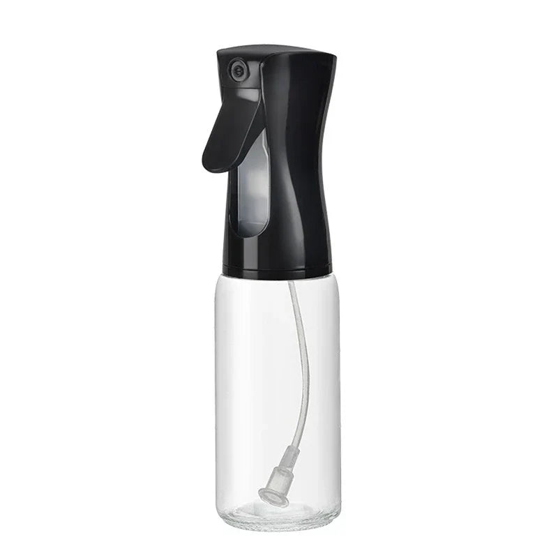 Mister Bottle - Single clear glass spray bottle with black pump top, empty, against plain white background.