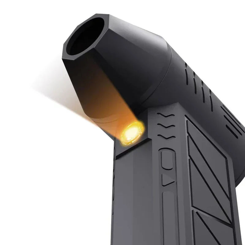 Air Circulator Fan - Close-up angled view of a black handheld air device with an illuminated warm LED light near its nozzle