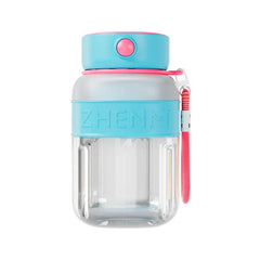 Blue and pink smoothie maker tumbler bottle with branded silicone band and pink carry strap on a white background