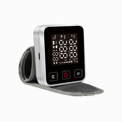 Bp Checker Machine - Side angle view of silver-cased wrist-worn blood pressure monitor with attached cuff laid flat