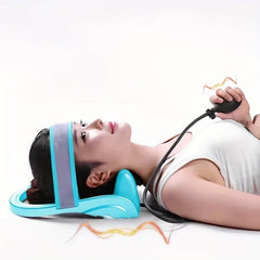 Inflatable Cervical Neck Traction Pillow - Person lying down using the traction device, holding the inflation bulb to adjust stretch level