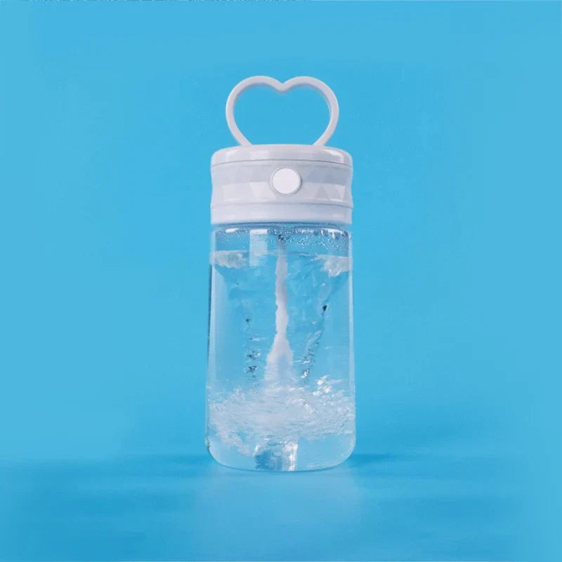 Insulated Coffee Travel Mug - Clear plastic water bottle with white heart handle lid, mixing liquid inside, set against solid bright blue background
