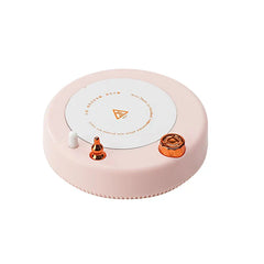 Insulated Mug - Round light pink tabletop warming coaster with white heating surface, copper and white control accents, printed caution markings