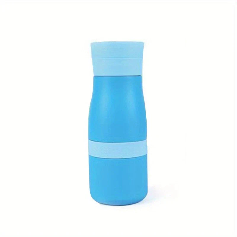 Stainless Steel Tumbler Cup - Blue insulated water bottle with lighter blue cap and midsection band, standing on white background