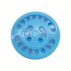 Pet Puzzle Feeder - Top-down view of round blue plastic pet puzzle toy with clear covered slots and empty holes
