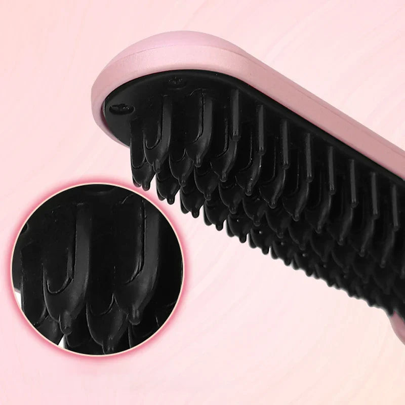 Heated Hair Straightening Brush - Close-up of a pink hair straightener brush head, with a magnified inset view of its black bristle tips.