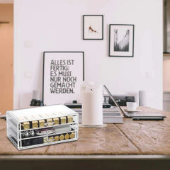 Cosmetic Organizer Case - Filled three-drawer storage unit placed on a wooden desktop holding small accessories