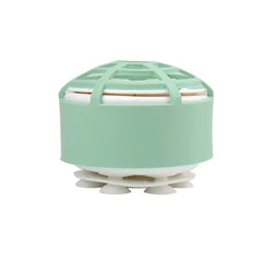 Mini Dishwasher - A mint green and white dome-shaped device with a lattice top, visible internal layers, and suction cups on its base
