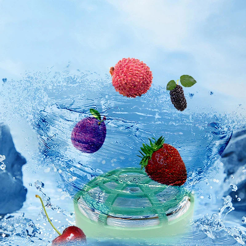 Mini Dishwasher - Mint green device partially submerged in splashing water surrounded by floating fresh fruit