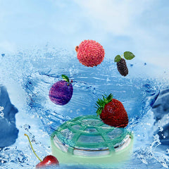 Mini Dishwasher - Mint green device partially submerged in splashing water surrounded by floating fresh fruit