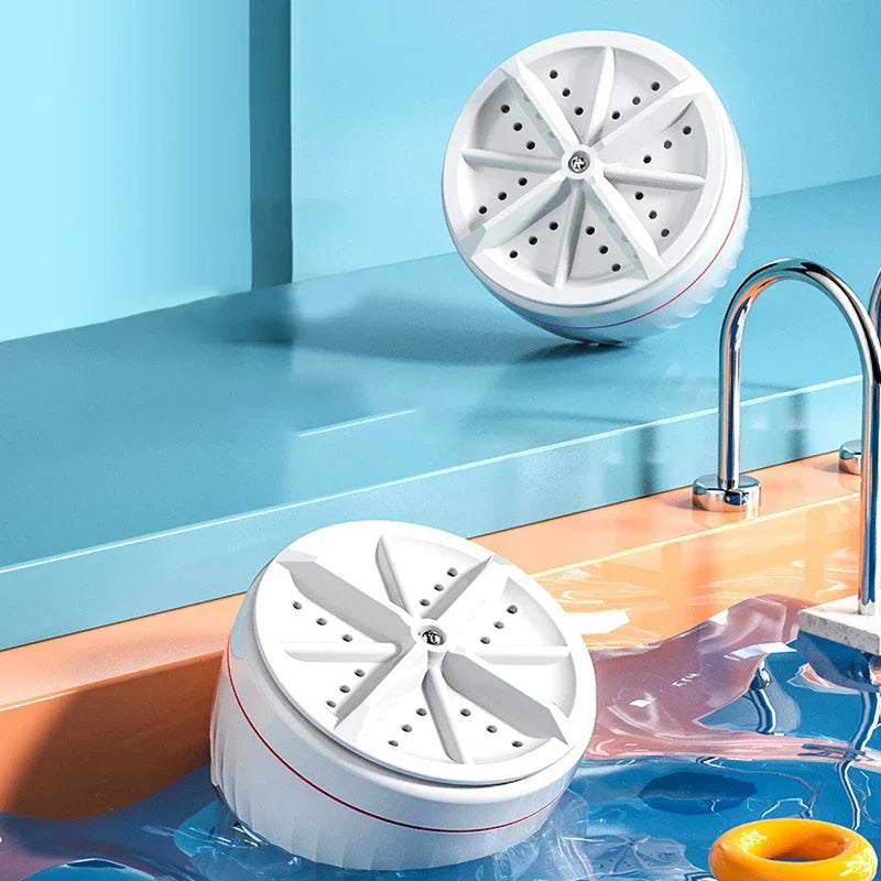 Mini Washer - Two units shown, one resting on a sink edge and one partially submerged in sink water