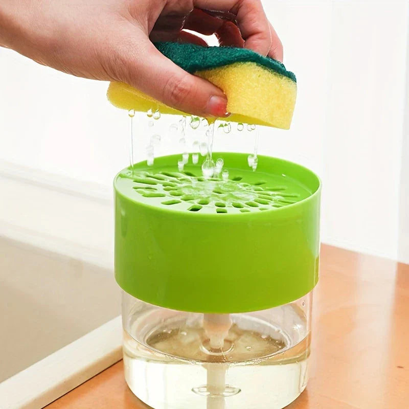 Kitchen Soap Dispenser Caddy - Hand squeezing a wet yellow and green sponge over a green topped liquid dispenser, water dripping from the sponge onto the dispenser top