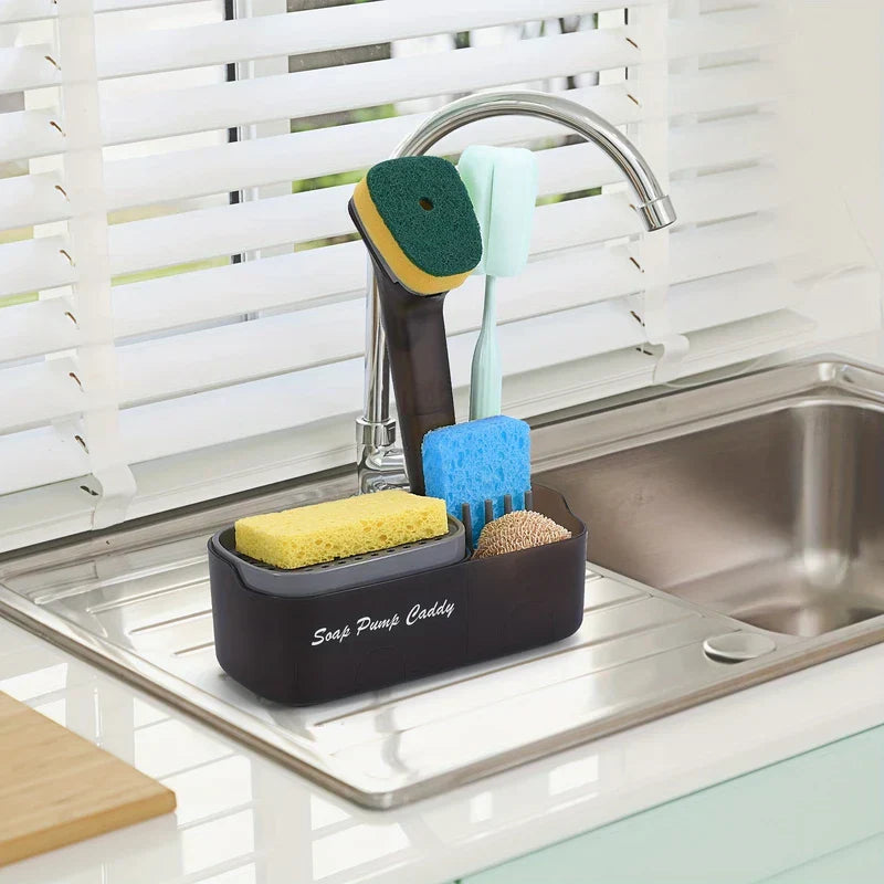 Kitchen Soap Dispenser - Caddy placed on a stainless steel sink drainer holding multiple cleaning tools