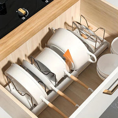 Kitchen Storage Rack - Adjustable divider holding pots and lids inside a kitchen drawer