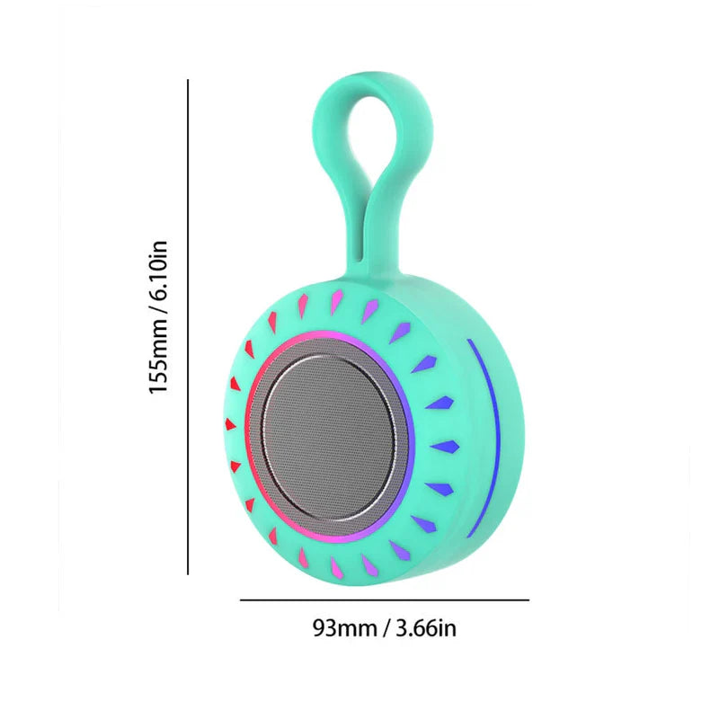 Portable Bluetooth Speaker - Turquoise portable speaker with integrated top loop, circular front, gradient pink-to-purple ring, red-to-blue accent marks, dimension lines showing size
