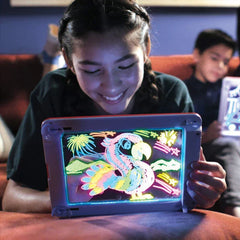 Drawing Board - Child holding a unit displaying a colorful glowing parrot drawing with built-in stand