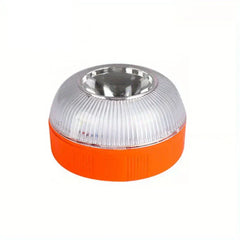 Warning Light - Compact round safety light with clear ribbed lens, silver reflector top, and bright orange base, shown against a plain white background