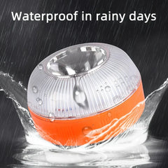 Warning Light - Light with water droplets on its surface, surrounded by splashing water to demonstrate rainy-day waterproof functionality