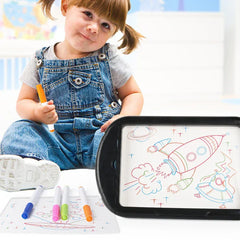 Led Magic Drawing Board - Toddler sitting behind a black-framed drawing board with space doodles and colored markers nearby
