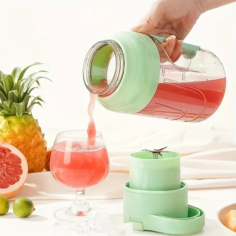Centrifugal Juicer Machine - Hand pouring pink juice from portable light green blender cup into stemmed glass, fresh fruits and blender base nearby