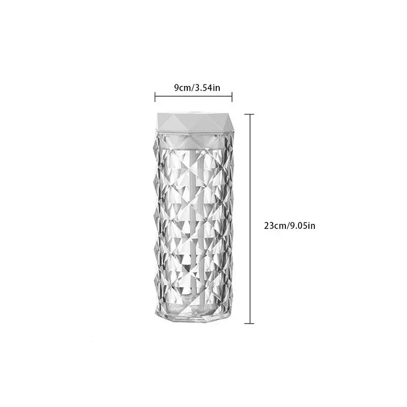 Cool Mist Humidifier - A diamond-textured transparent cylinder product with a light gray geometric top, shown against a plain white background with 9cm width and 23cm height dimension markings.