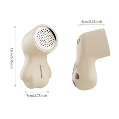 Sweater Fabric Defuzzer Machine - Cat paw-shaped lint shaver shown from two side angles with dimension labels in inches and centimeters