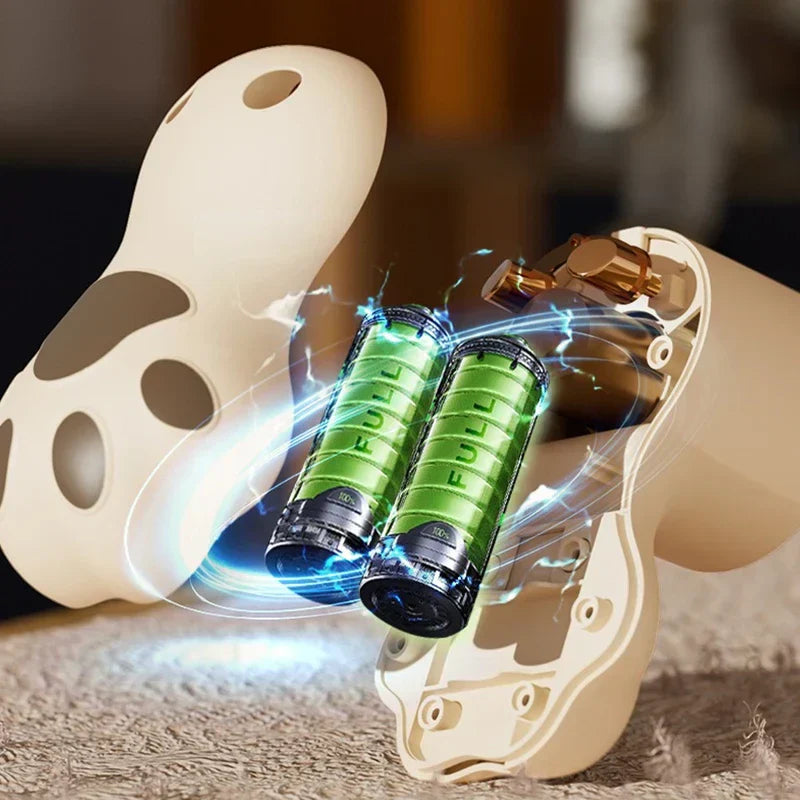 Sweater Fabric Defuzzer Machine - Cutaway view of a paw-shaped handheld device showing two green internal batteries with blue electric effect graphics