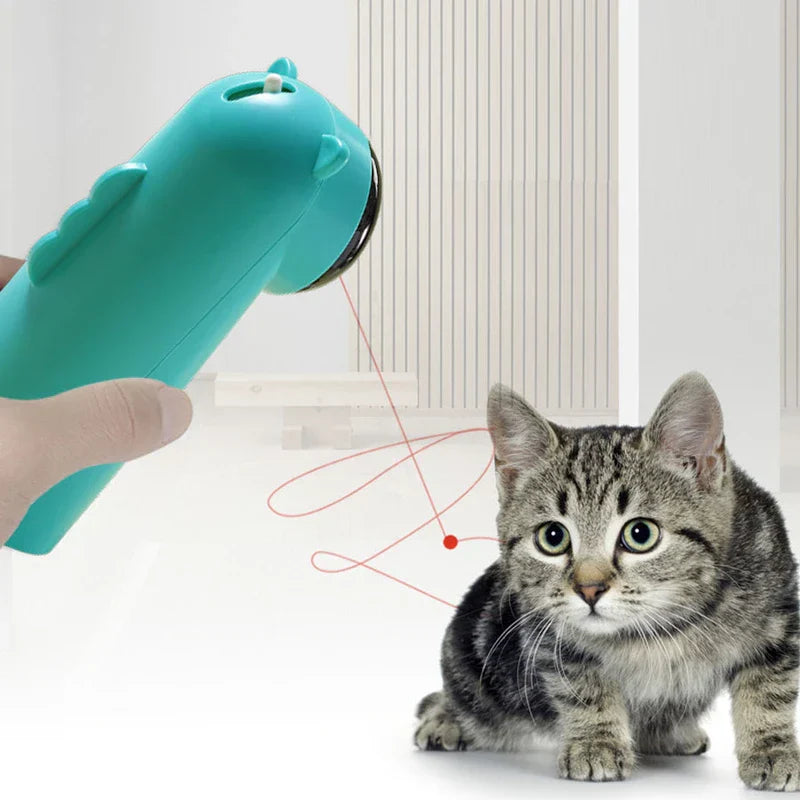 Laser Pointer - Hand holding the same turquoise bear device emitting red laser, cat looks at the light.