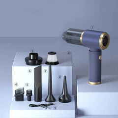 Stick Vacuum - Blue handheld vacuum with numbered black accessories and charging cable laid out on white stepped blocks