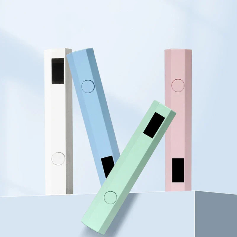 Nail Wand - Four pastel colored hexagonal curing devices arranged on a light blue surface