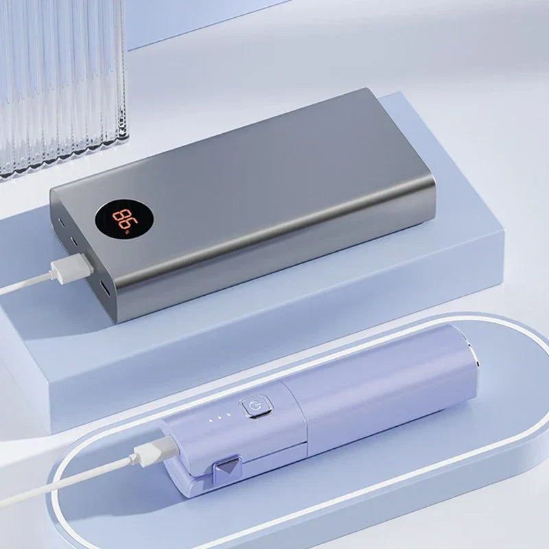 Mini Hair Straightener - Gray power bank with digital display and light purple portable device on light blue platforms, both with charging cables attached