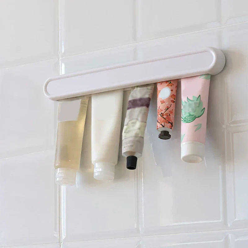 Wall-mounted facial cleanser holder near a bathroom sink