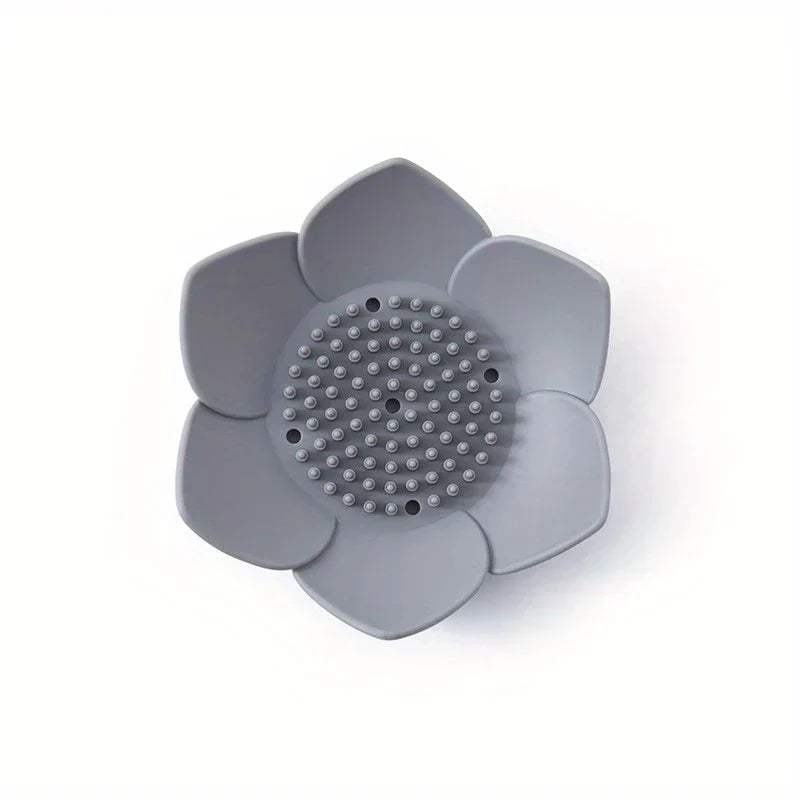 Soap Dish Holder - Top-down view of gray lotus-shaped holder showing raised textured center and drainage holes