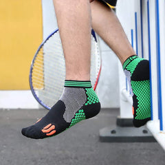 Casual Socks Pack - Close-up of a person’s foot in a short athletic sock, raised near a tennis racket, showing the sock’s textured green side panels