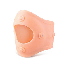 Peach-colored flexible knee sleeve with circular raised nodes and a patella cutout, shown against a plain white background.
