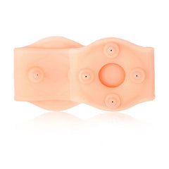 Magnetic Circular Wrist Brace Wrap - Flat lay of peach-colored flexible wrist support with embedded raised nodes and central circular cutout