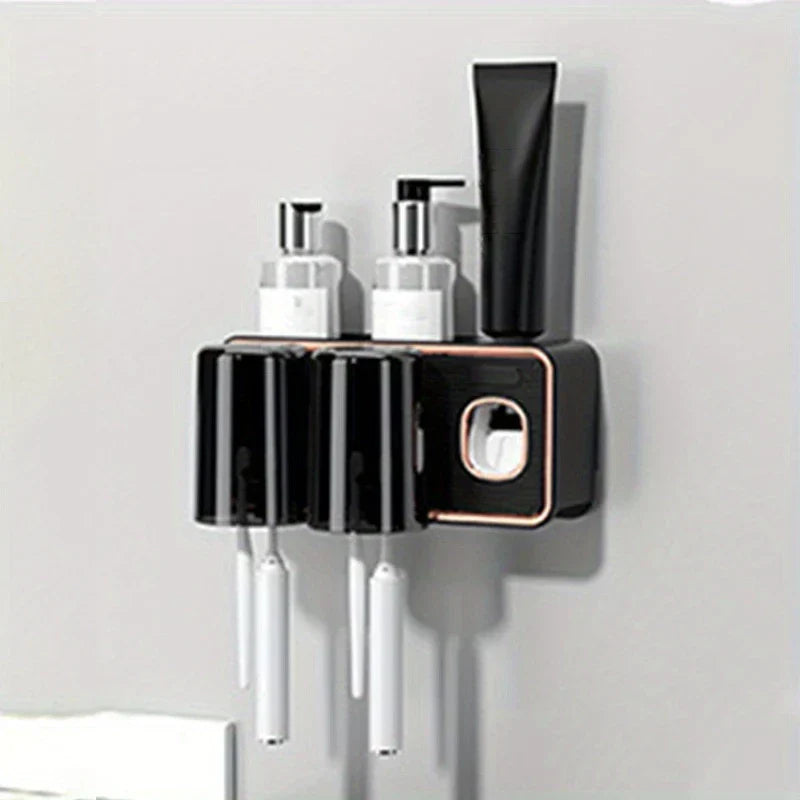Magnetic Toothbrush Holder Set - Wall-mounted holder with two inverted cups, toothbrush slots, top shelf holding two pump bottles and a toothpaste tube, built-in toothpaste dispenser