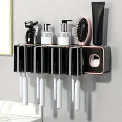 Magnetic Toothbrush Holder Set - Wall-mounted toothbrush holder with black glossy inverted cups, holding electric toothbrushes, with toiletries on its top shelf against a light wall.