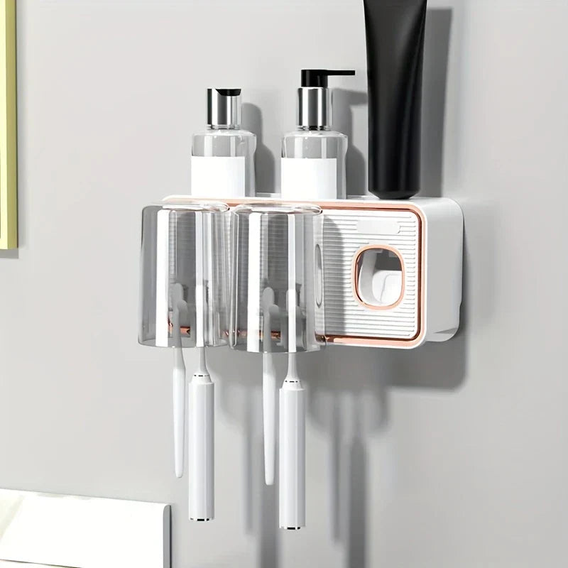 Magnetic Toothbrush Holder Set - Wall-mounted toothbrush holder with two transparent inverted cups holding toothbrushes, toiletries on its top shelf against a light wall.