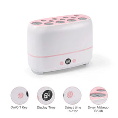 White and pink makeup brush dryer with labeled controls, time display showing 6H, and top brush slots.