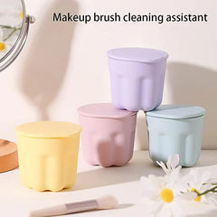 Makeup Brush Set - Four pastel lidded containers arranged on a white surface, with text reading 'Makeup brush cleaning assistant' above them.
