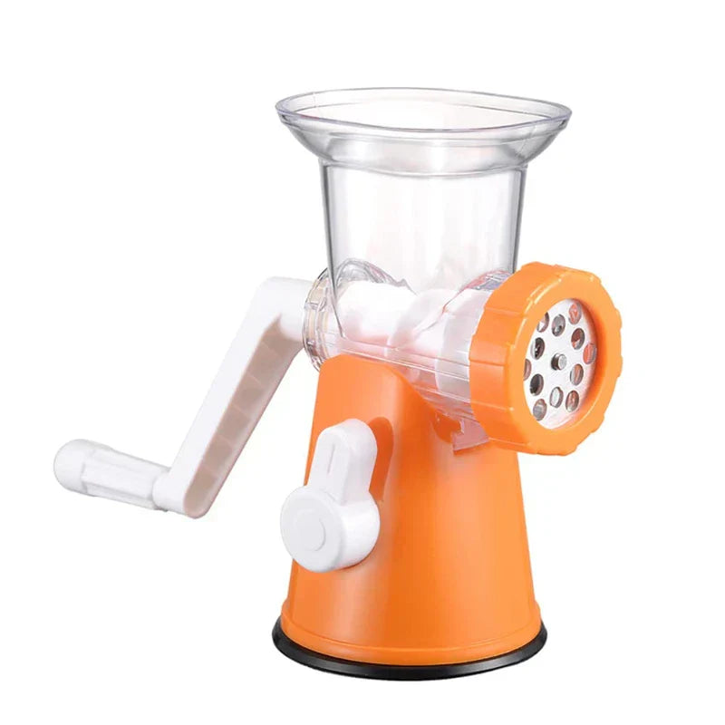 Mincer - Orange and white hand-crank kitchen grinder with clear hopper and metal grinding plate, front studio view