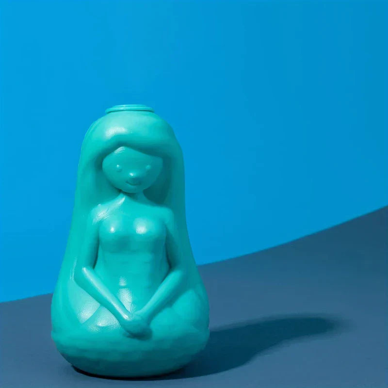 Automatic Toilet Bowl Cleaner - Turquoise mermaid shaped cleaning product displayed on dark surface against bright blue background