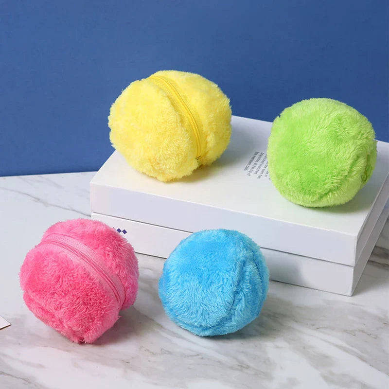 Microfiber Robotic Mop Ball Cleaner - Four colorful fuzzy zippered round cleaning covers arranged on stacked white boxes