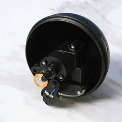 Microfiber Robotic Mop Ball Cleaner - Open black plastic casing showing internal motor and battery components, on marble surface.