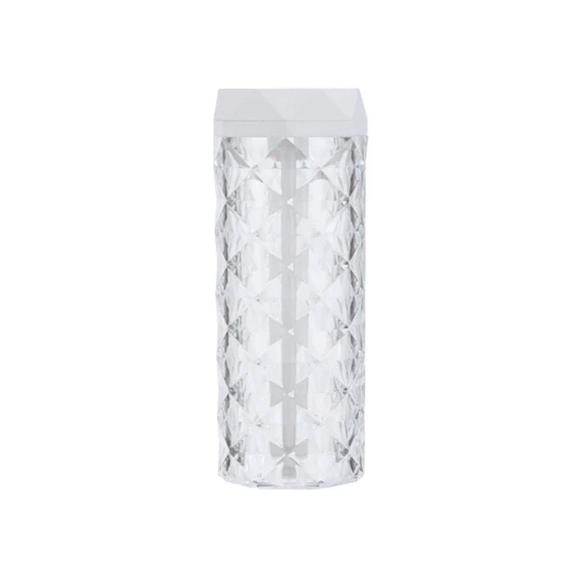 Cool Mist Humidifier - Clear faceted crystal-patterned humidifier with white angular top cap, shown against a plain white background