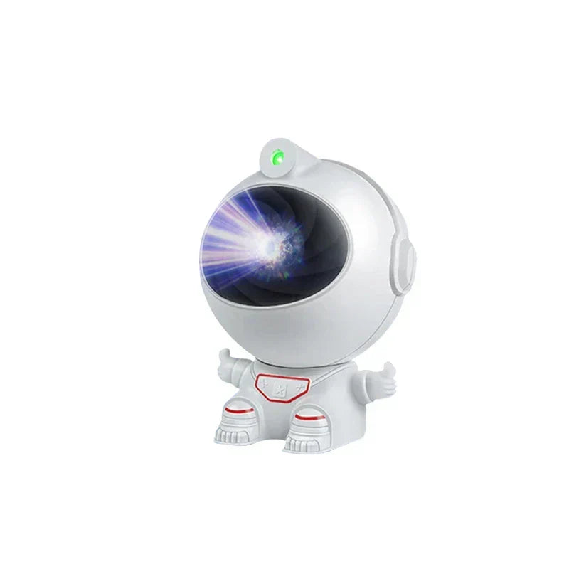 Mini Astronaut Projector - White astronaut-shaped light with raised thumbs, projecting bright starburst light from its visor, with small green indicator light on top