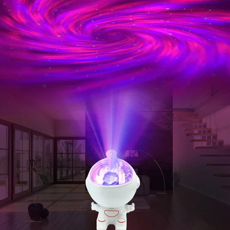 Mini Astronaut Projector - Astronaut light projector projecting swirling purple and pink light patterns onto a ceiling.