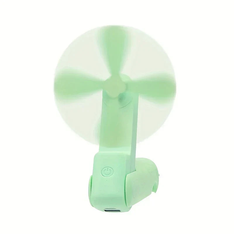 ventilador mini - unidad de color verde claro en posición abierta en funcionamiento con aspas girando